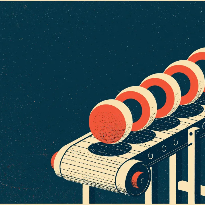 A conveyor belt carrying a row of identical red domed items
