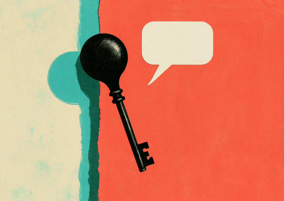 A black key shaped with a speech-bubble head against a split red and teal ground