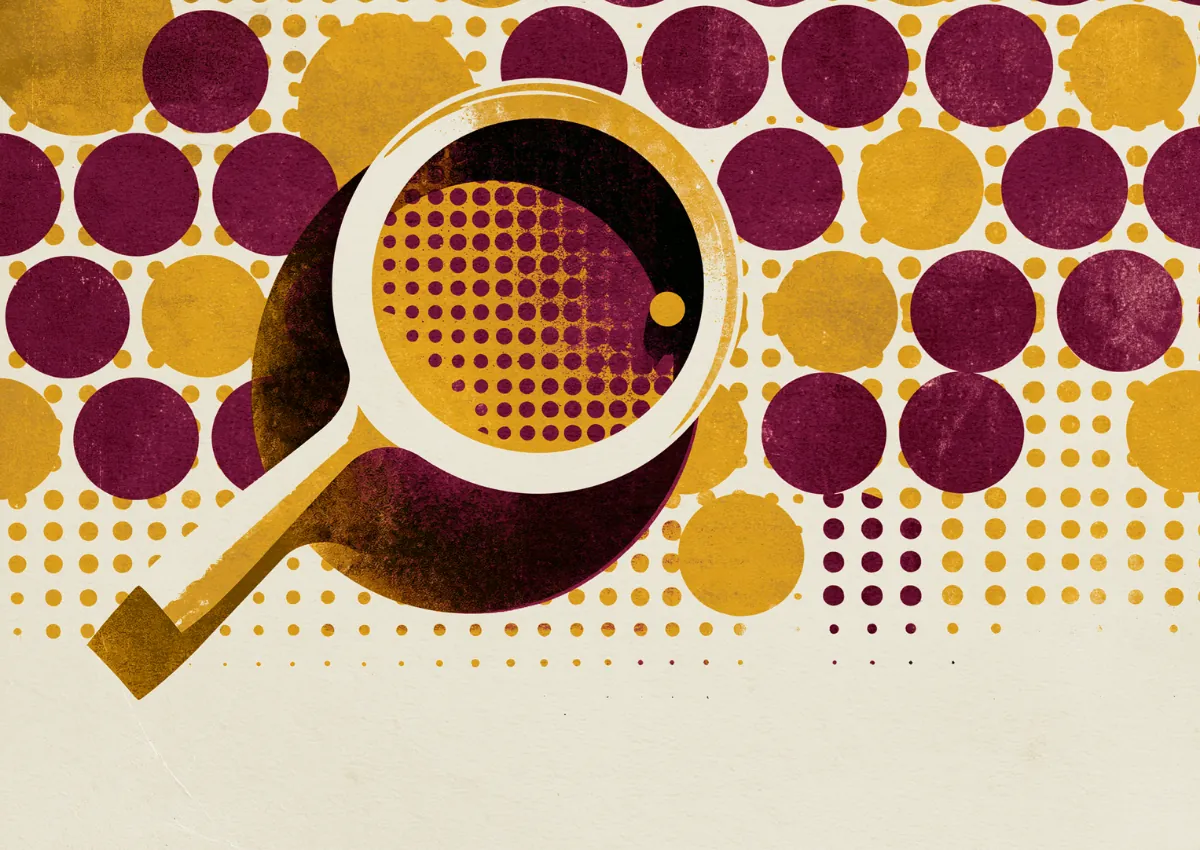 A magnifying glass held over a field of halftone dots, enlarging a few