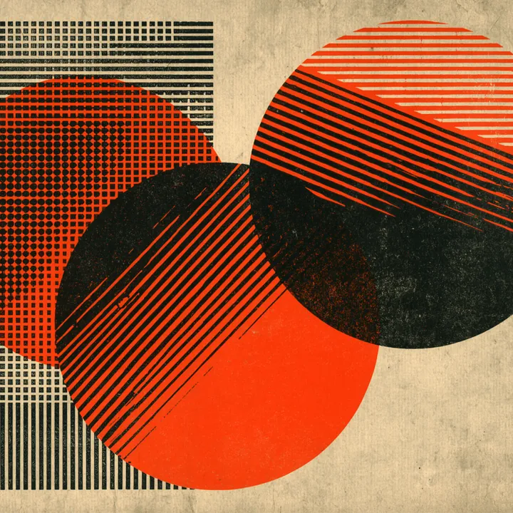 Two overlapping circles in red and black halftone forming an intersecting lens