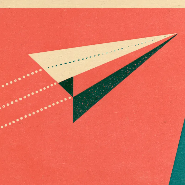 A paper airplane taking off